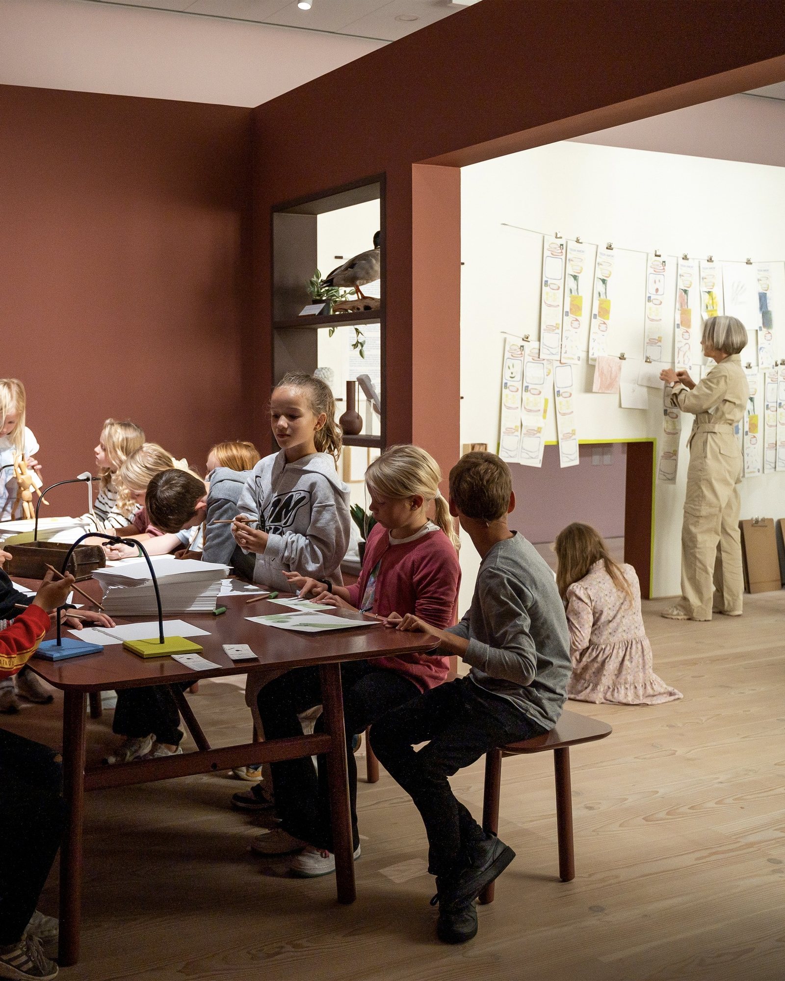 Tegn Amok, children drawing at the workshop table