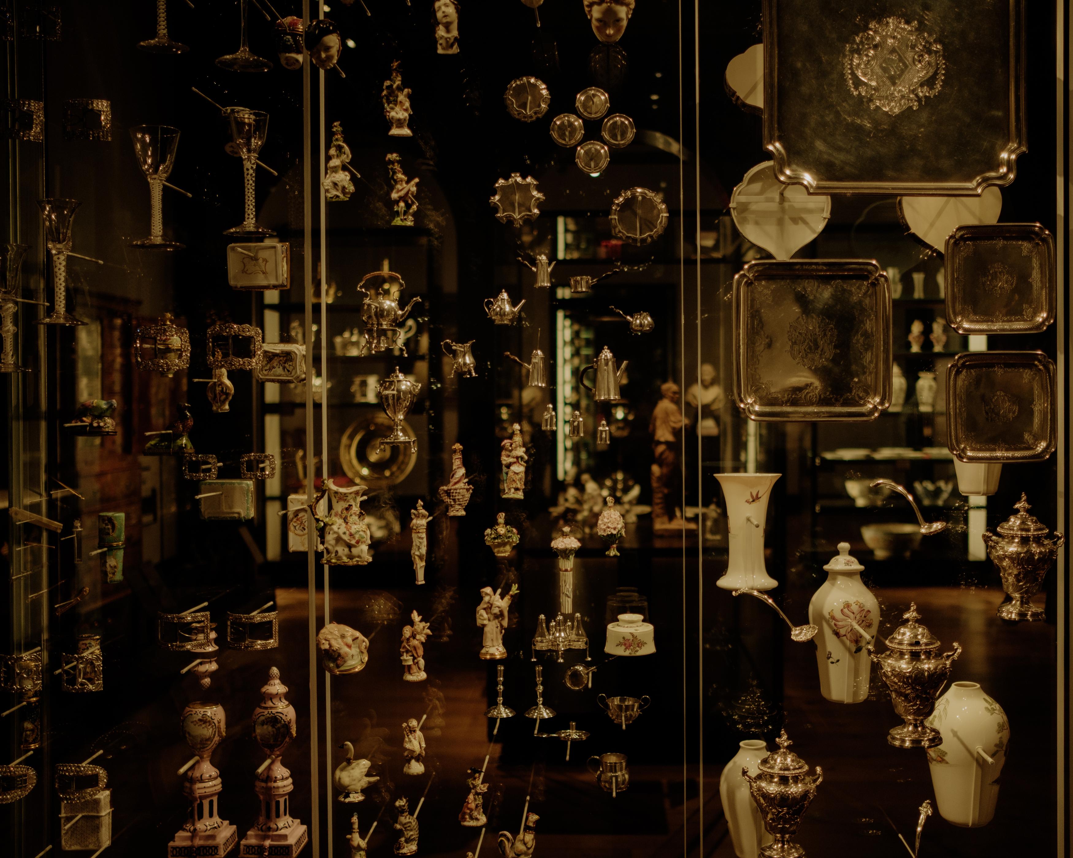 KINN Studio — cabinet of curiosities with silver and porcelain